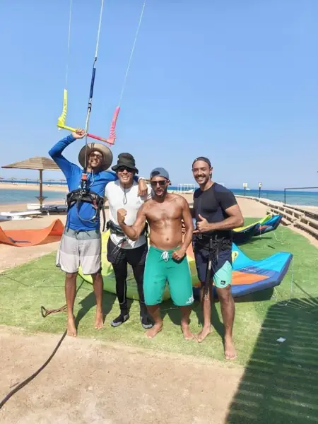 The Kite Fly team on the beach with a kite bar